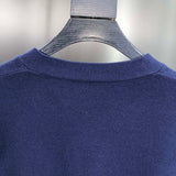 Side profile of Louis Vuitton luxury clothing with signature branding