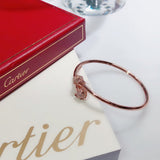 Close-up detail view of Cartier unisex jewelry piece