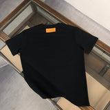 Close-up detail shot of Louis Vuitton cotton t-shirt with label-forward styling