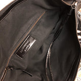 Side profile of polished elevated women's handbag – women's statement bag