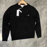 Close-up detail shot of Lacoste luxury clothing with monogram-inspired silhouette