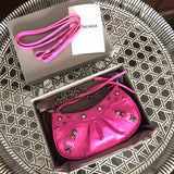 Handle and strap detail of modern polished women's handbag – women's designer-style accessory