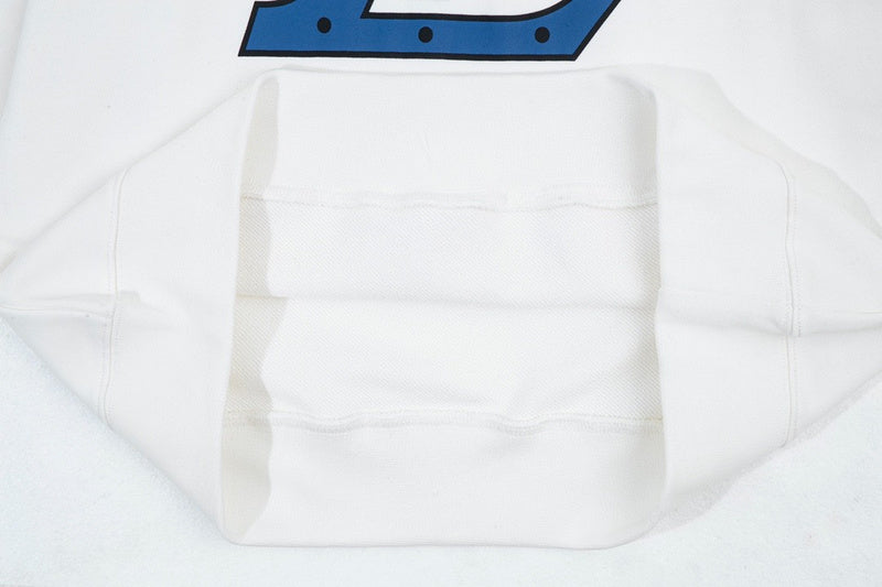 Side profile of Louis Vuitton luxury clothing with signature branding