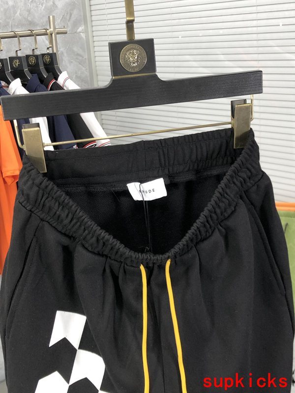Side profile of Rhude luxury clothing with logo-detail design