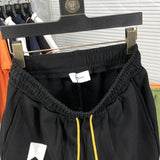 Side profile of Rhude luxury clothing with logo-detail design
