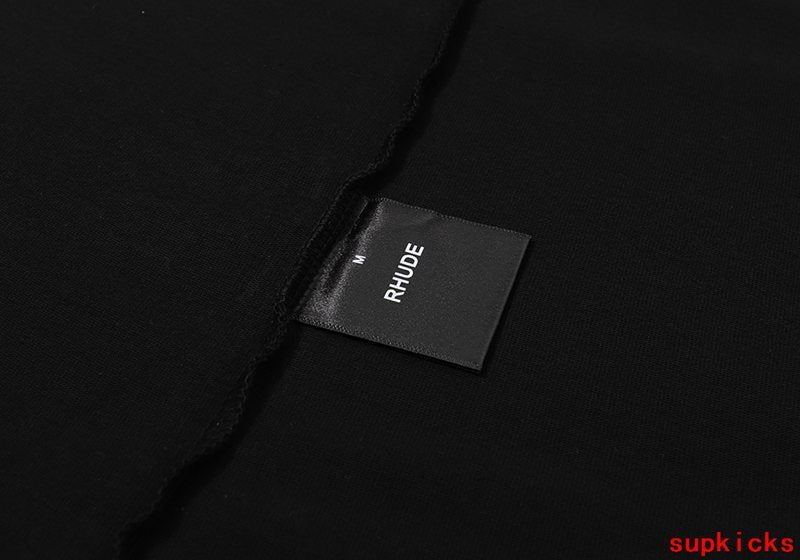 Close-up detail shot of Rhude luxury clothing with contemporary cut