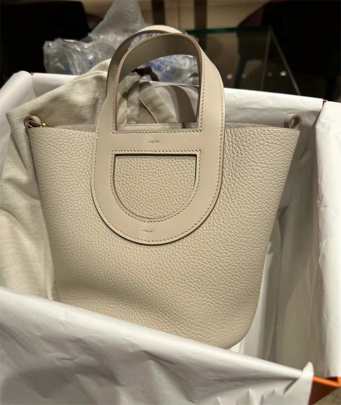 Side view of poised structured handbag