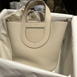 Side view of poised structured handbag