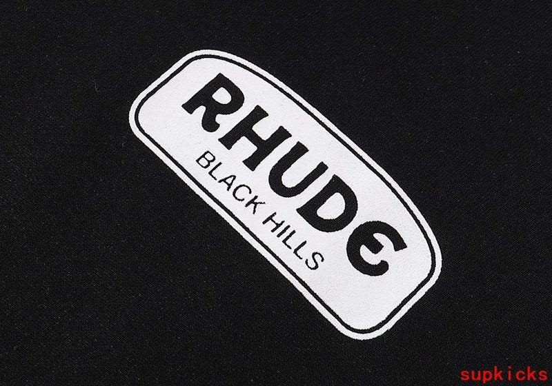 Side profile of Rhude luxury clothing with signature branding