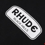 Side profile of Rhude luxury clothing with signature branding