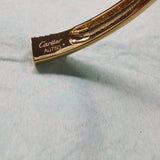 Side view of Cartier unisex jewelry piece