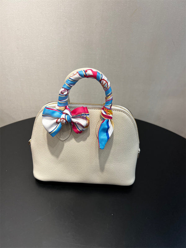  tailored top-handle bag styled with outfit