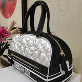 Styled lifestyle shot of polished structured women's handbag – women's everyday handbag
