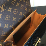 Styled lifestyle shot of elevated refined women's handbag – women's luxury accessory