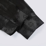 Flat lay presentation of Louis Vuitton luxury clothing with logo-detail design