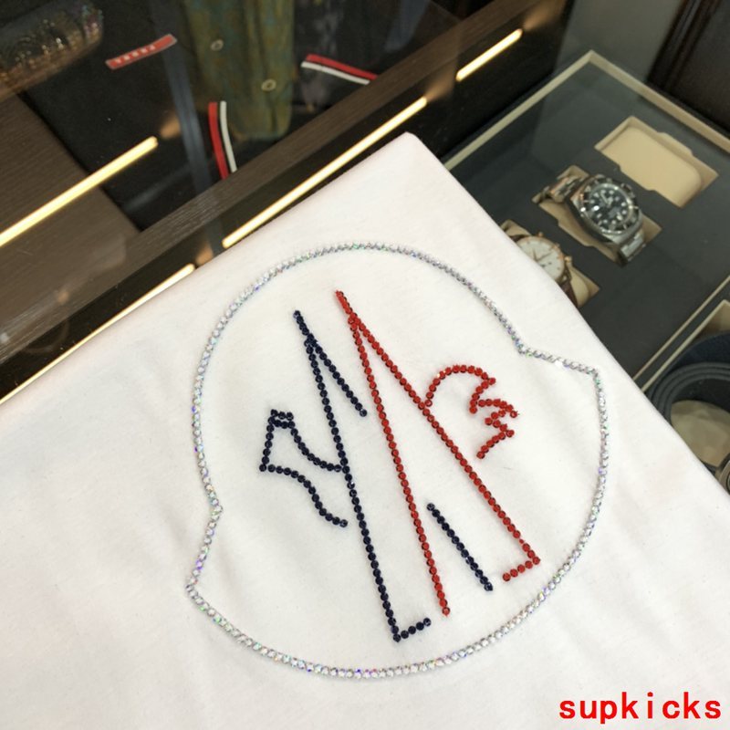 Close-up detail shot of Moncler luxury clothing with tailored silhouette
