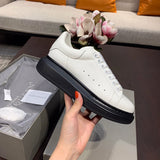 Side profile of Alexander McQueen classic monochrome sneakers everyday casual design