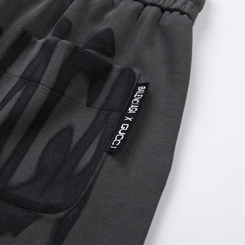 Close-up detail shot of Gucci luxury clothing with monogram-inspired silhouette