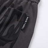 Close-up detail shot of Gucci luxury clothing with monogram-inspired silhouette