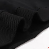 Close-up detail shot of Rhude luxury clothing with everyday silhouette