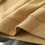 Close-up detail shot of Gucci luxury clothing with signature branding