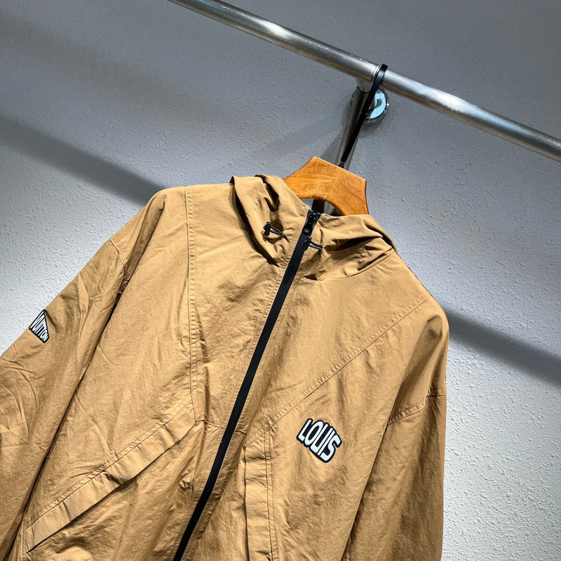Close-up detail shot of Louis Vuitton luxury clothing with label-forward styling