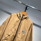 Close-up detail shot of Louis Vuitton luxury clothing with label-forward styling
