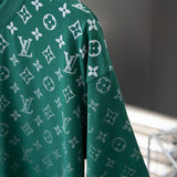 Flat lay presentation of Louis Vuitton cotton t-shirt with signature branding