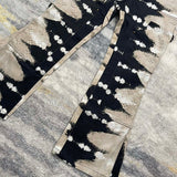 Close-up detail shot of Louis Vuitton luxury clothing with label-forward styling