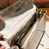 Side view of polished structured handbag