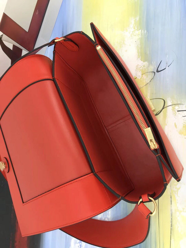 Front view of classic polished women's handbag – women's luxury accessory