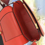 Front view of classic polished women's handbag – women's luxury accessory