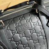 Styled lifestyle shot of elevated sleek women's handbag – women's luxury accessory