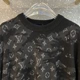 Full styled look of Louis Vuitton luxury clothing with label-forward styling