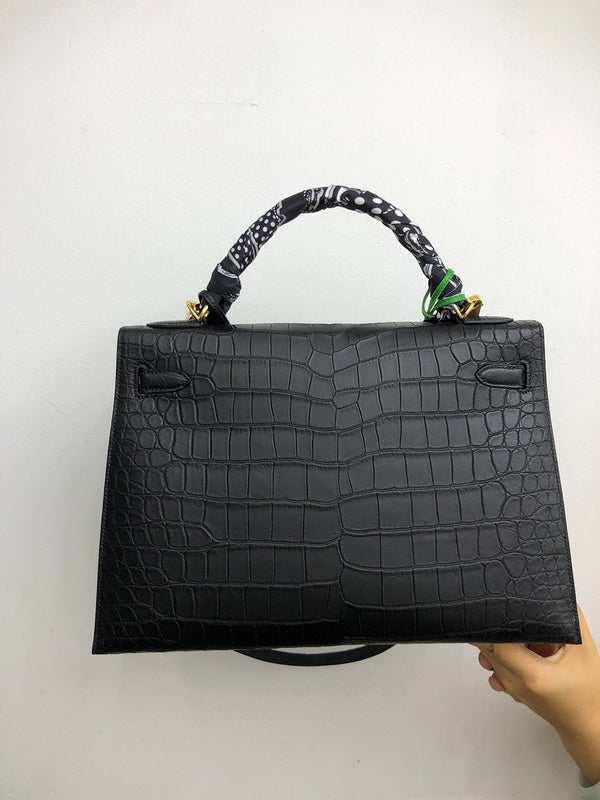 Side view of minimalist structured handbag