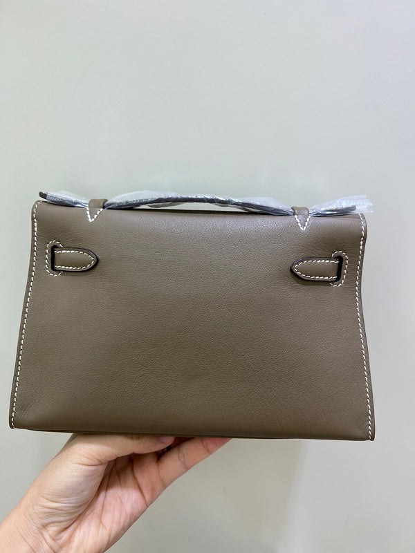 Side view of streamlined structured handbag
