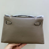 Side view of streamlined structured handbag