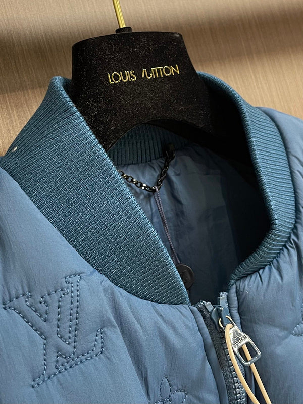 Close-up detail shot of Louis Vuitton luxury clothing with logo-detail design
