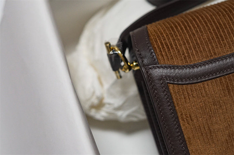 Side view of polished structured handbag