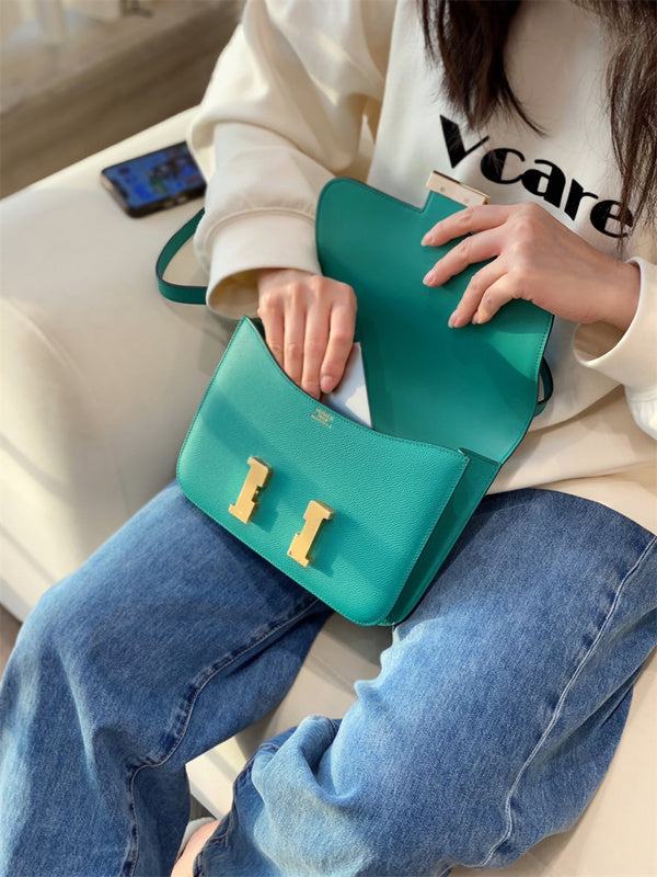 Side view of streamlined structured handbag