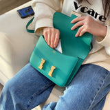 Side view of streamlined structured handbag