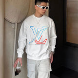 Flat lay presentation of Louis Vuitton luxury clothing with streetwear-inspired cut