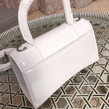 Side profile of chic elevated women's handbag – women's statement bag