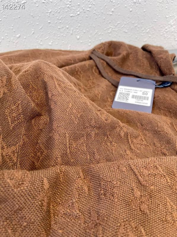 Flat lay presentation of Louis Vuitton luxury clothing with streetwear-inspired cut