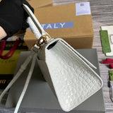 Handle and strap detail of classic structured women's handbag – women's designer-style accessory