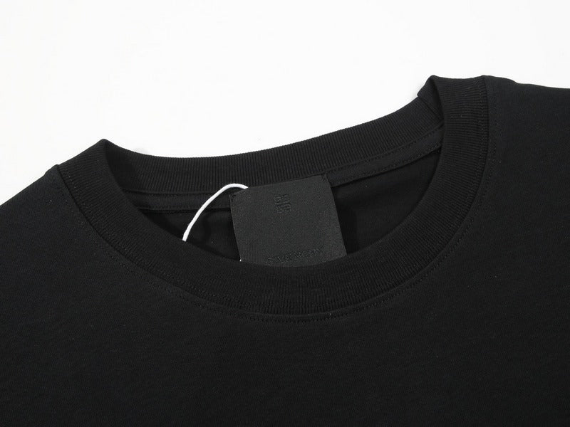 Close-up detail shot of Givenchy luxury clothing with monogram-inspired silhouette