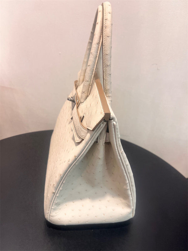 Side view of structured structured handbag
