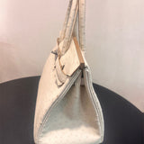 Side view of structured structured handbag
