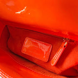 Side profile of structured signature women's handbag – women's designer-style accessory