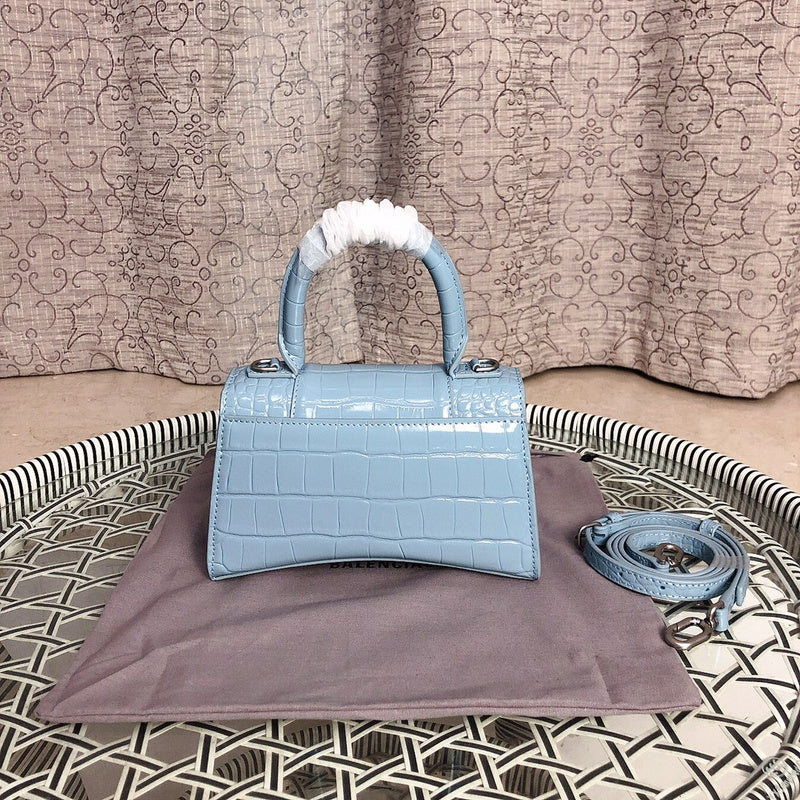 Styled lifestyle shot of structured polished women's handbag – women's designer-style accessory